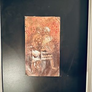 Made in Senegal. Metal piece.